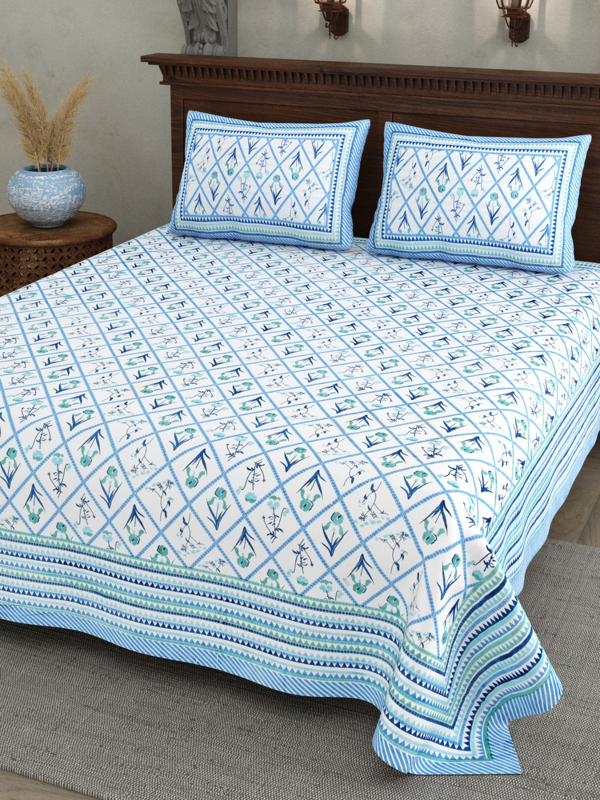 Sky blue checks design premium cotton bedsheet with matching pillow covers on double bed