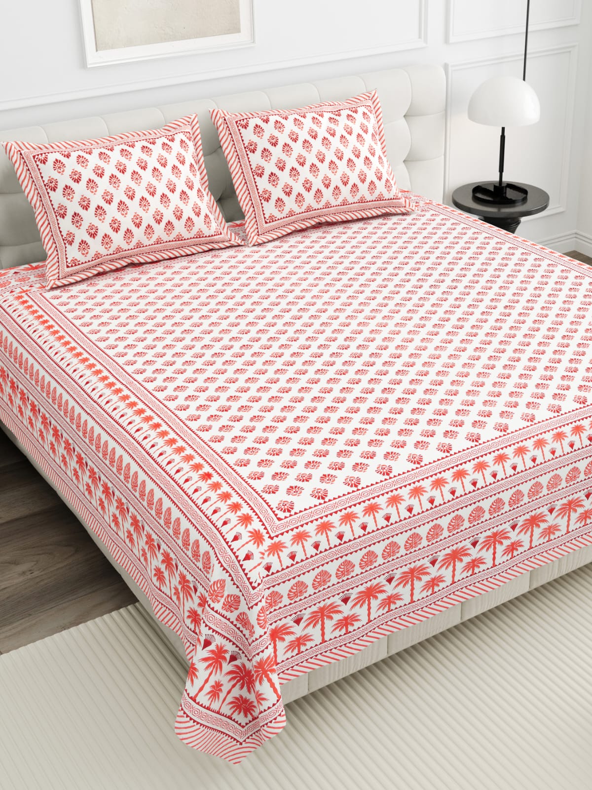 Premium cotton double bed bedsheet set with two pillow covers on bed