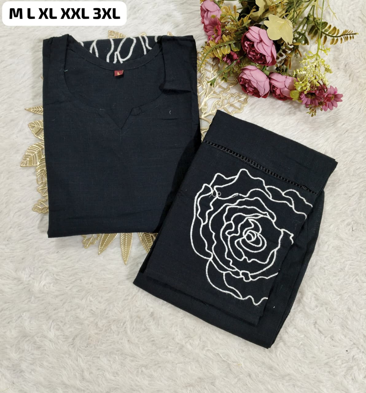 Black co-ord set with elegant thread embroidery and stitched top and pants in premium fabric