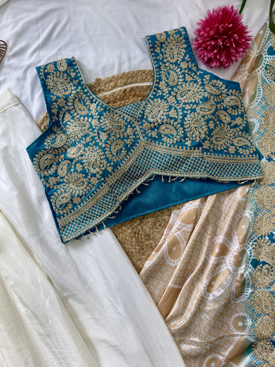 Teal blue Indo-Western blouse with multi-thread embroidery and sequins detailing on silk fabric