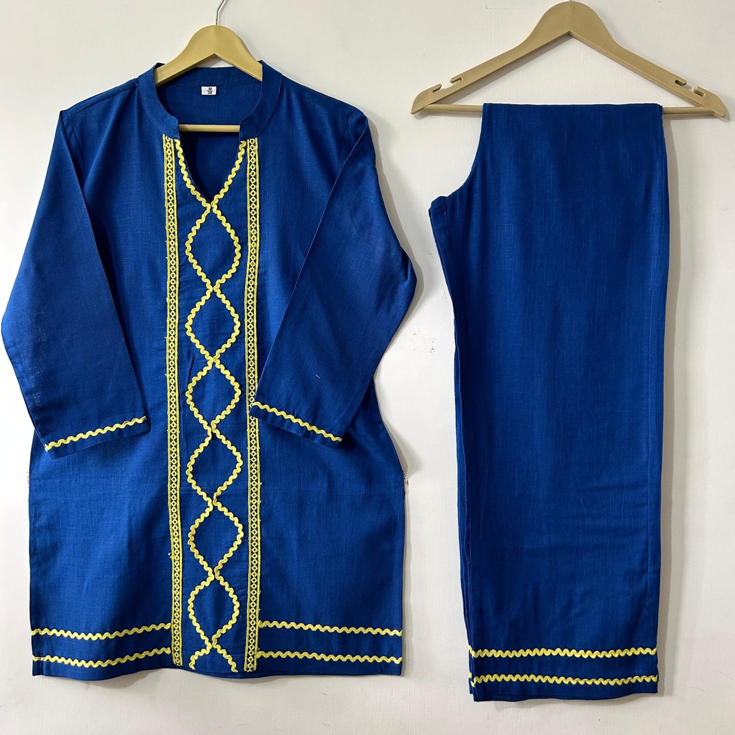 Royal blue traditional African co-ord set with yellow embroidery, long-sleeve tunic and straight-leg trousers