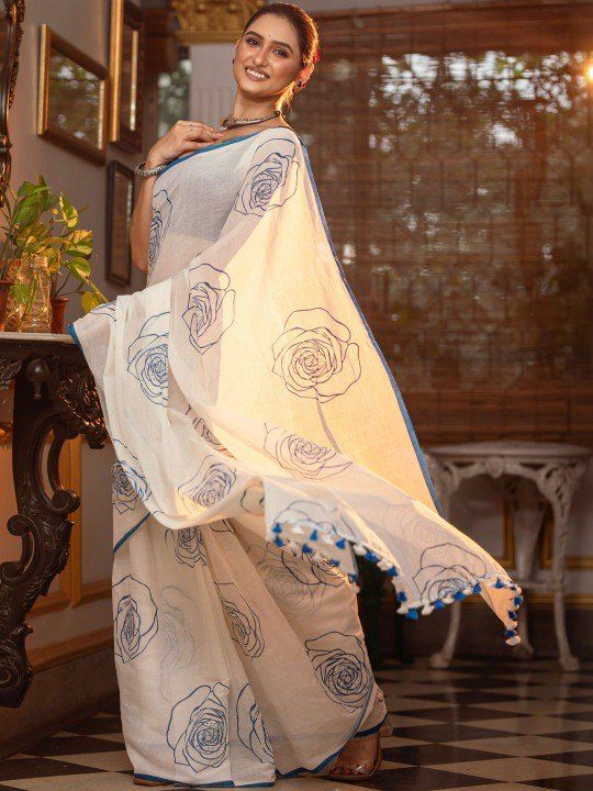 White and blue floral cotton saree with digital printing and hand-made zalar design