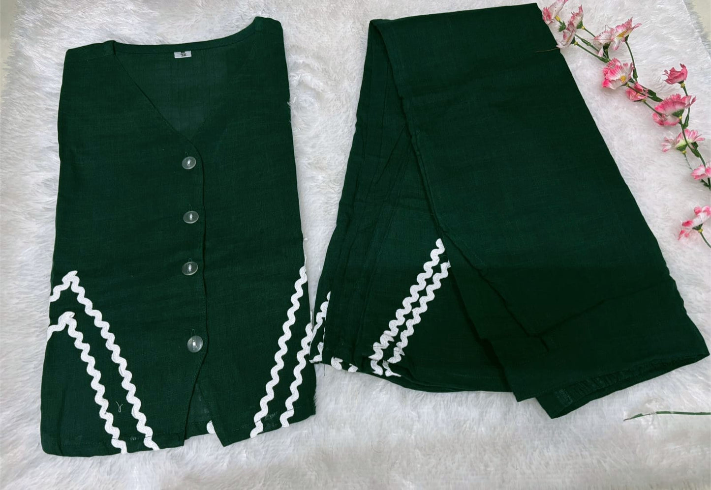 Woman wearing cotton green co-ord set with beautiful embroidery and cotton slub plazzo pants