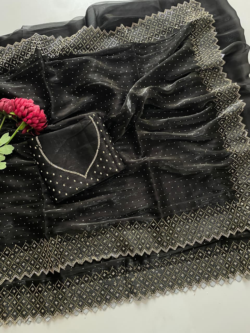 Beautiful black Jmy Choo saree with heavy Jarkan and diamond work and matching blouse