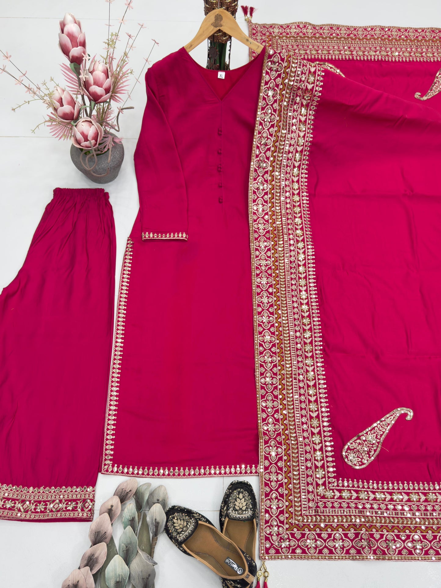 Rani Pink Heavy Suit with embroidery detailing in Roman silk fabric, full stitched, featuring sequins and fancy latkan dupatta