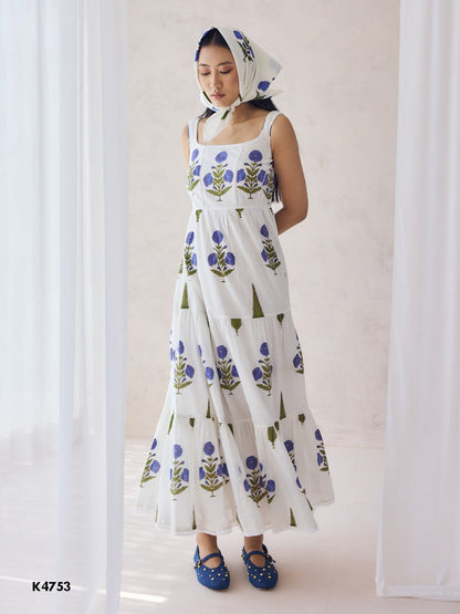 White one piece dress with blue floral embroidery on cotton fabric