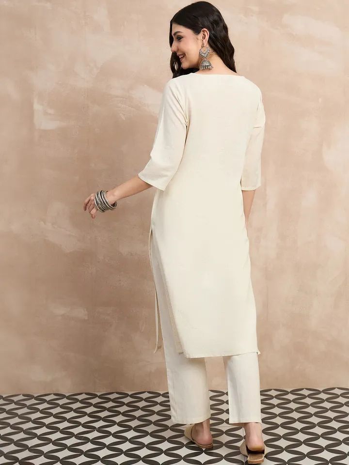 Ivory kurta pant set with blue embroidered motifs for office wear and casual outings