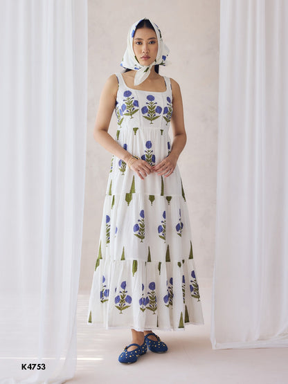 White one piece dress with blue floral embroidery on cotton fabric
