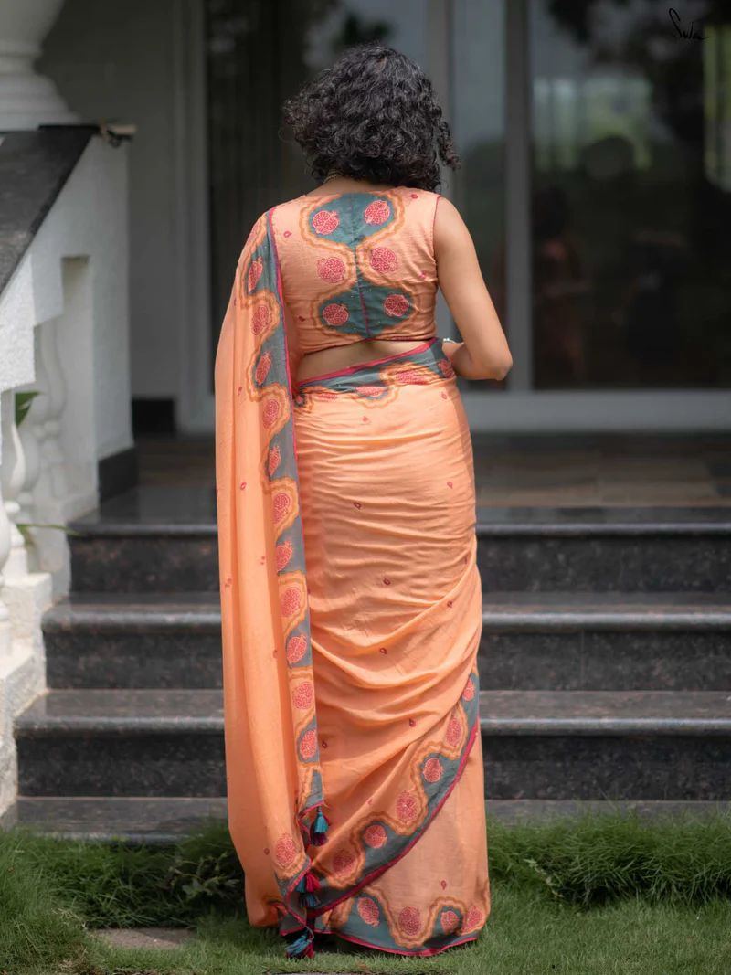 Peach Printed Saree with Contrast Border