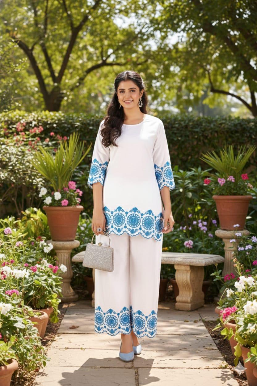 White cotton co-ord set with intricate embroidery on top and pants for women