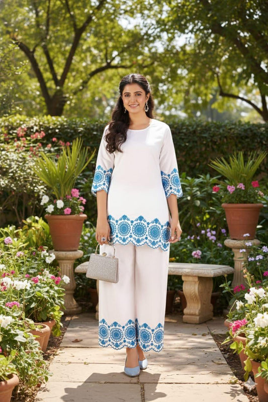 White cotton co-ord set with intricate embroidery on top and pants for women